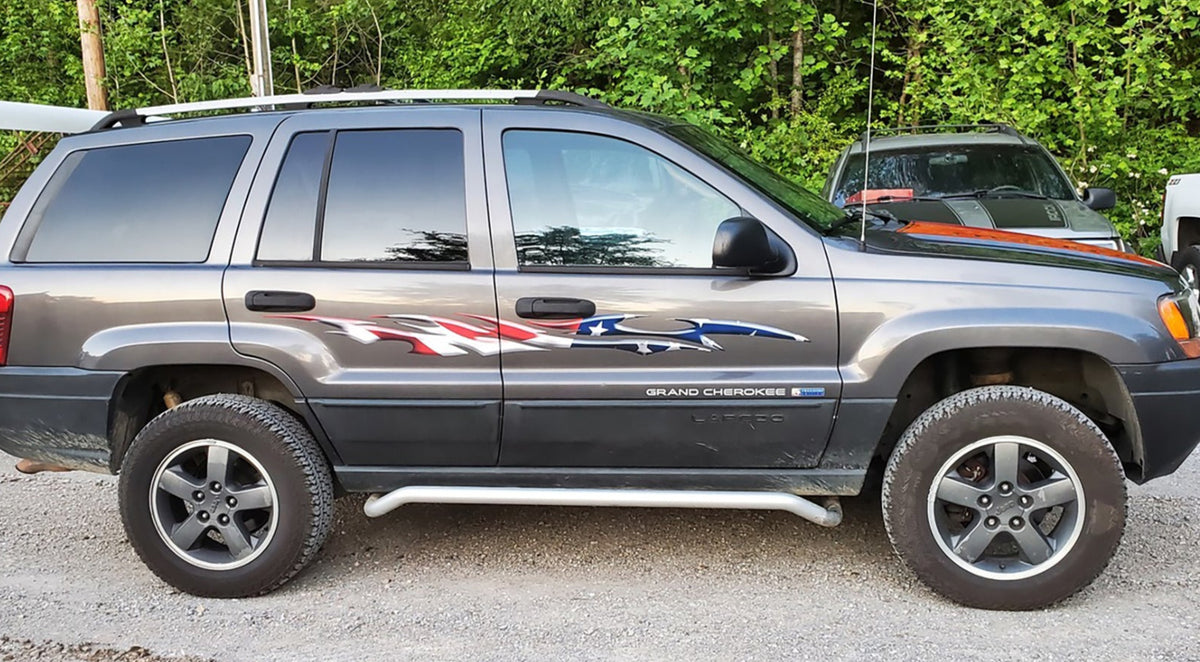 american flag flames decal on the side of Grand Cherokee jeep